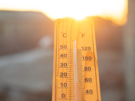 Thermometer on sky background. Sunset. Weather